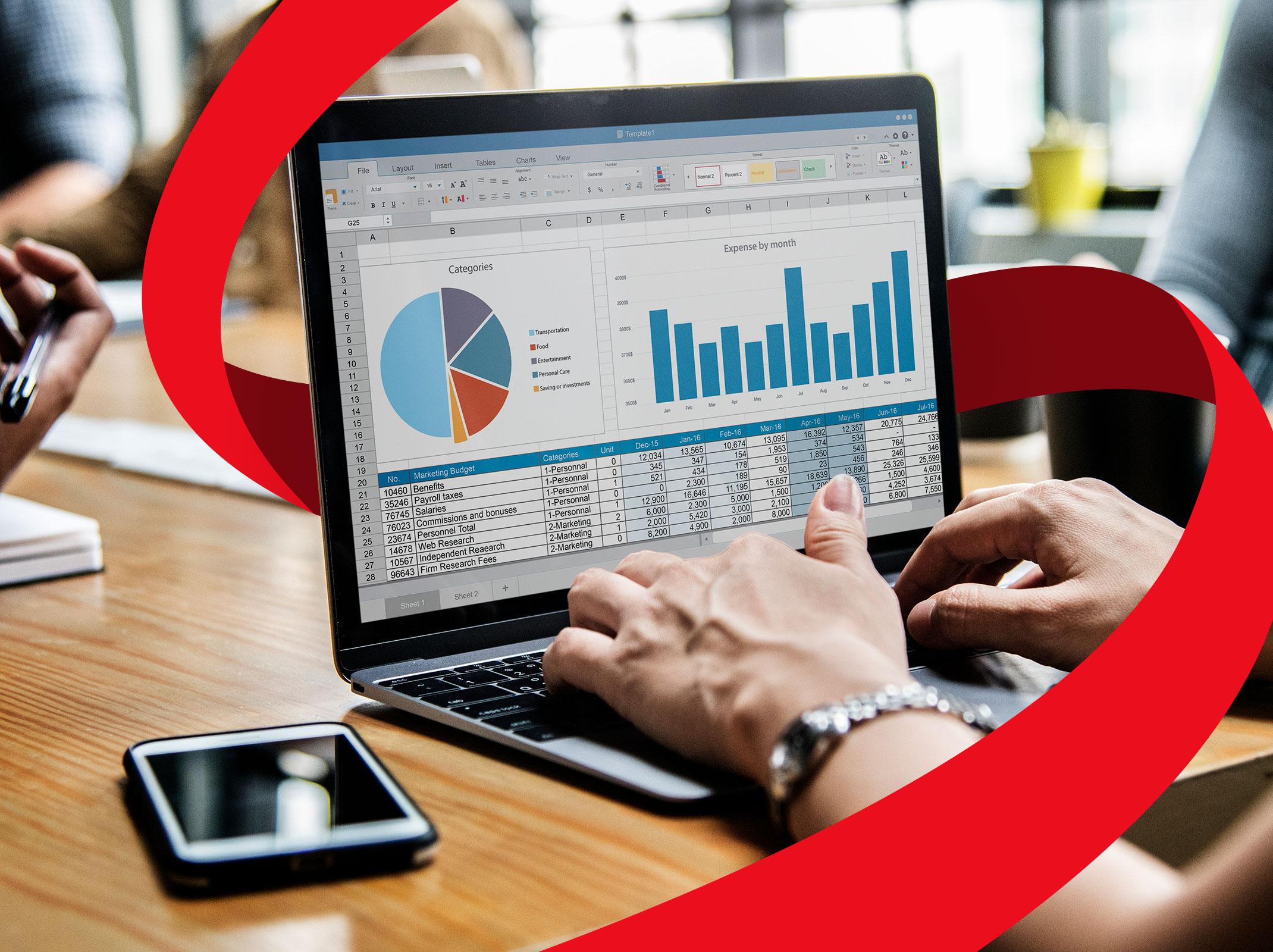 Business professional using Excel to analyze data