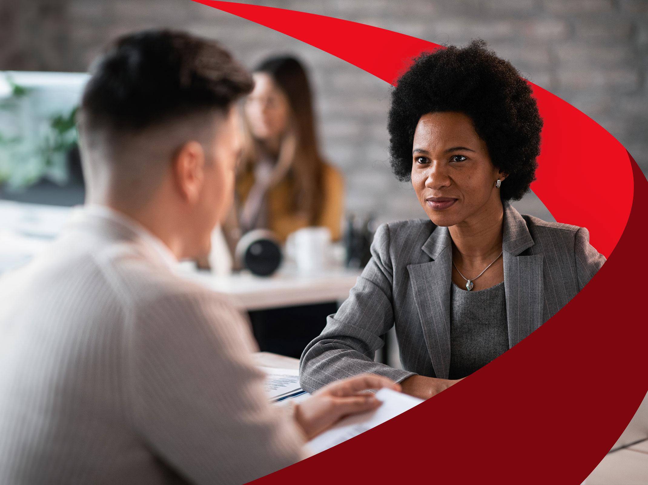 Professional female having an unbiased conversation with a coworker