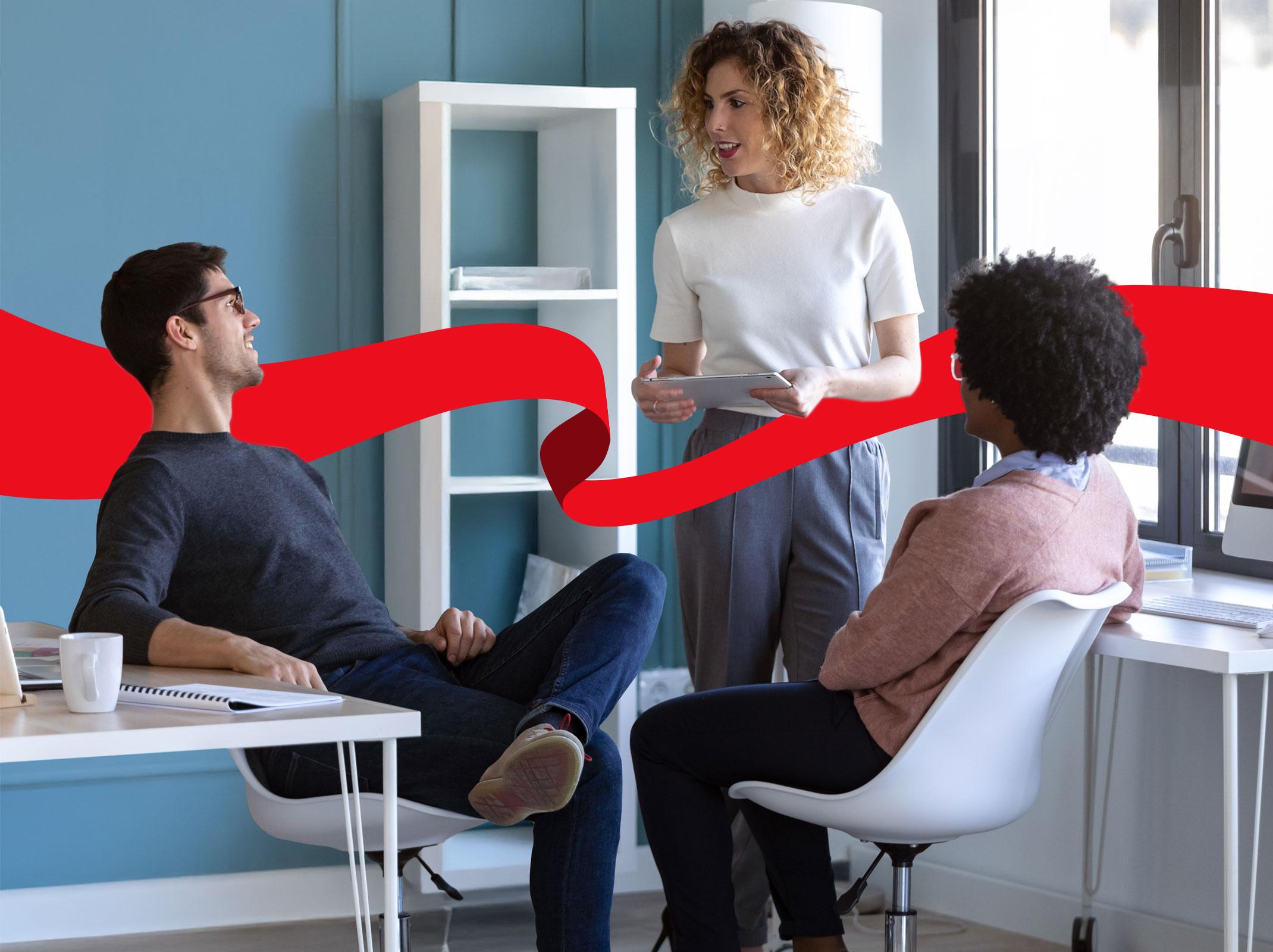 Co-workers having a business conversation at the office