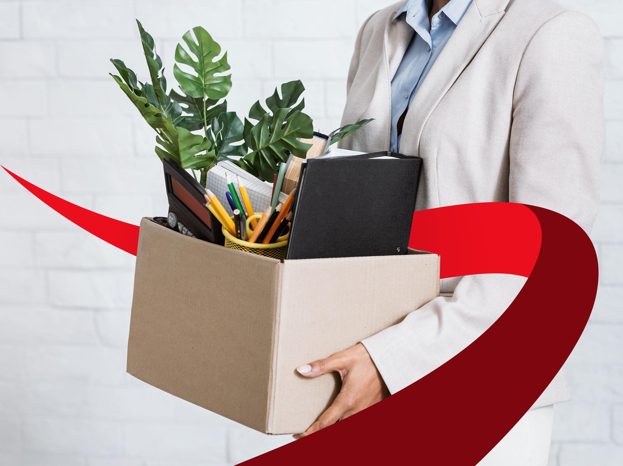 Woman with box of personal items