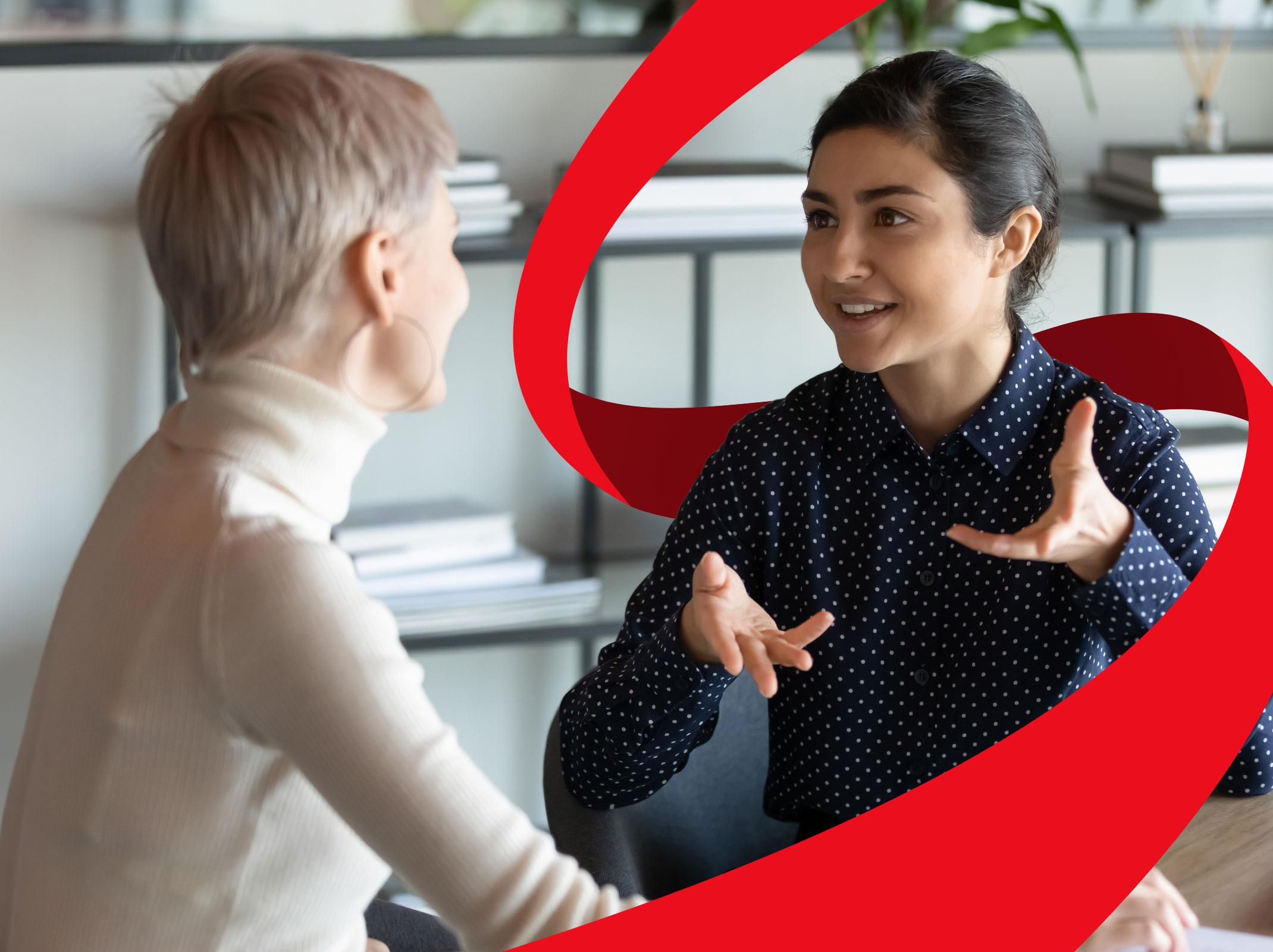 First-time supervisor in discussion with co-worker