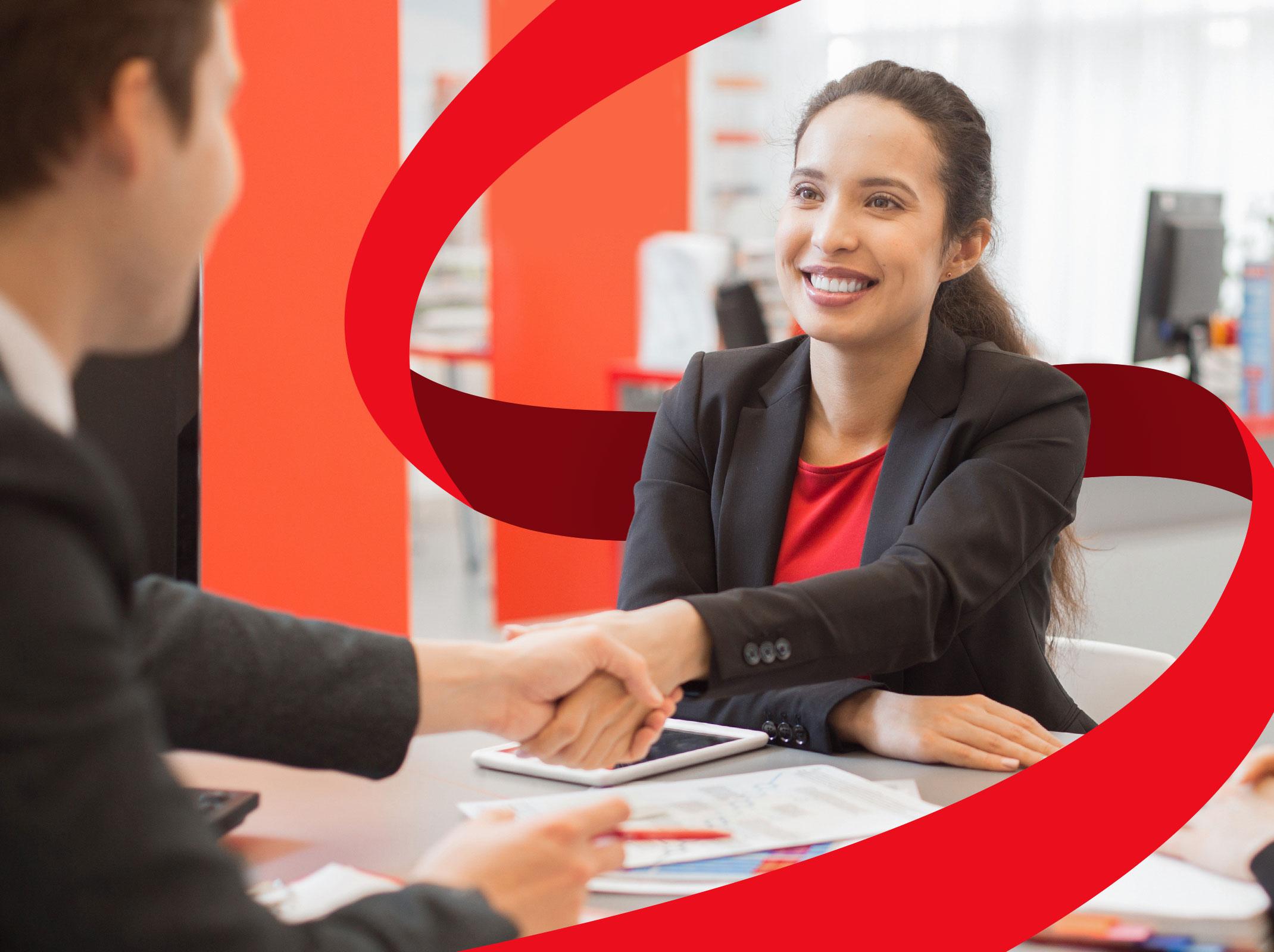 Assertive business professional shaking hands with manager