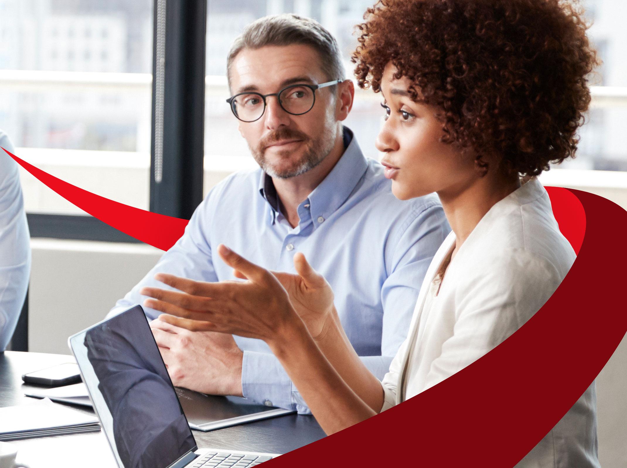 Business professionals in meeting using good communication strategies