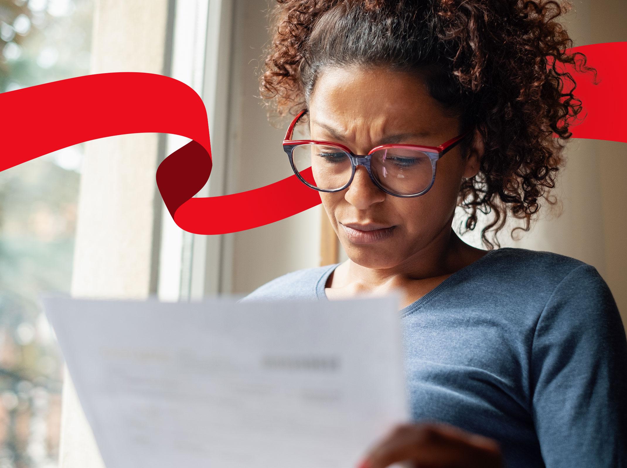 Confused looking business professional reading a financial statement