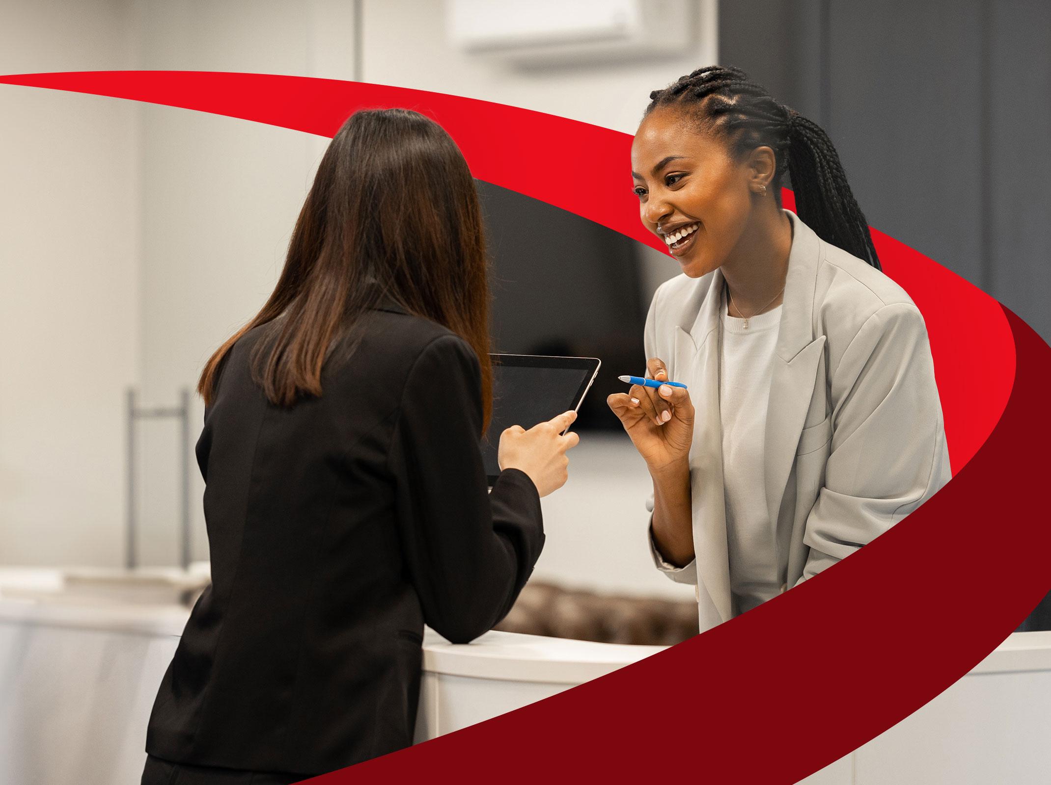 Friendly front desk professional helping visitors