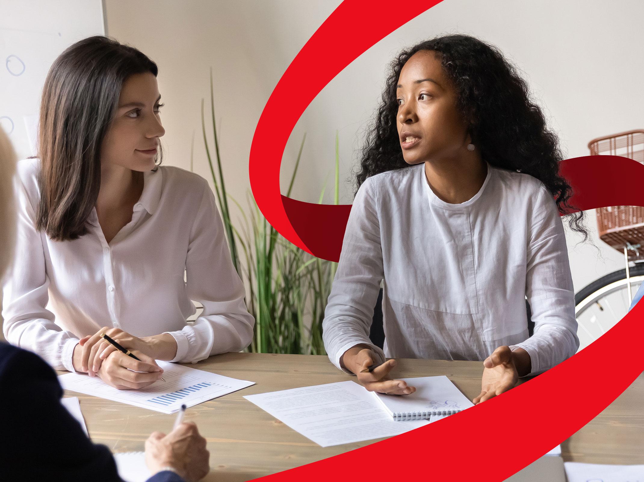 Manager using conflict resolution strategies in a team meeting