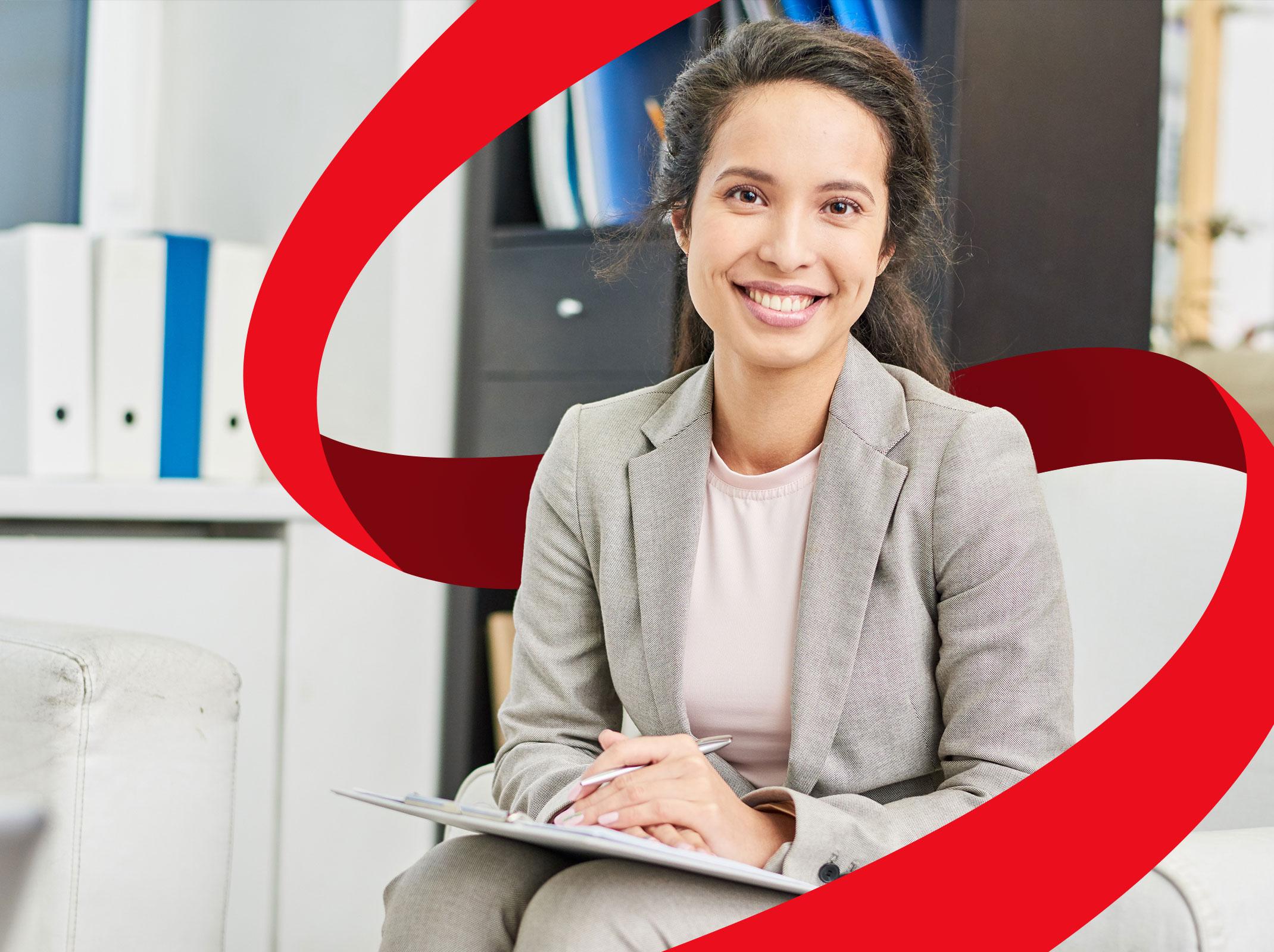 Administrative assistant with a clipboard in an office
