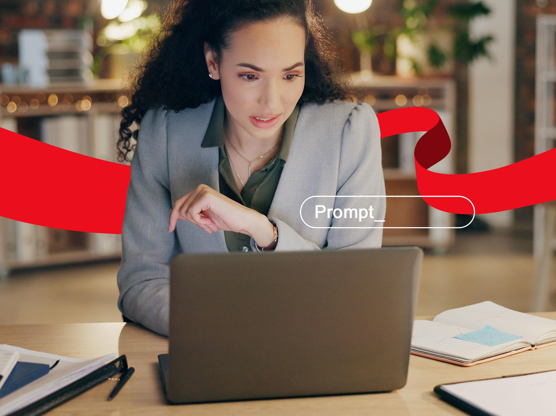 Administrative professional typing a prompt into her office laptop