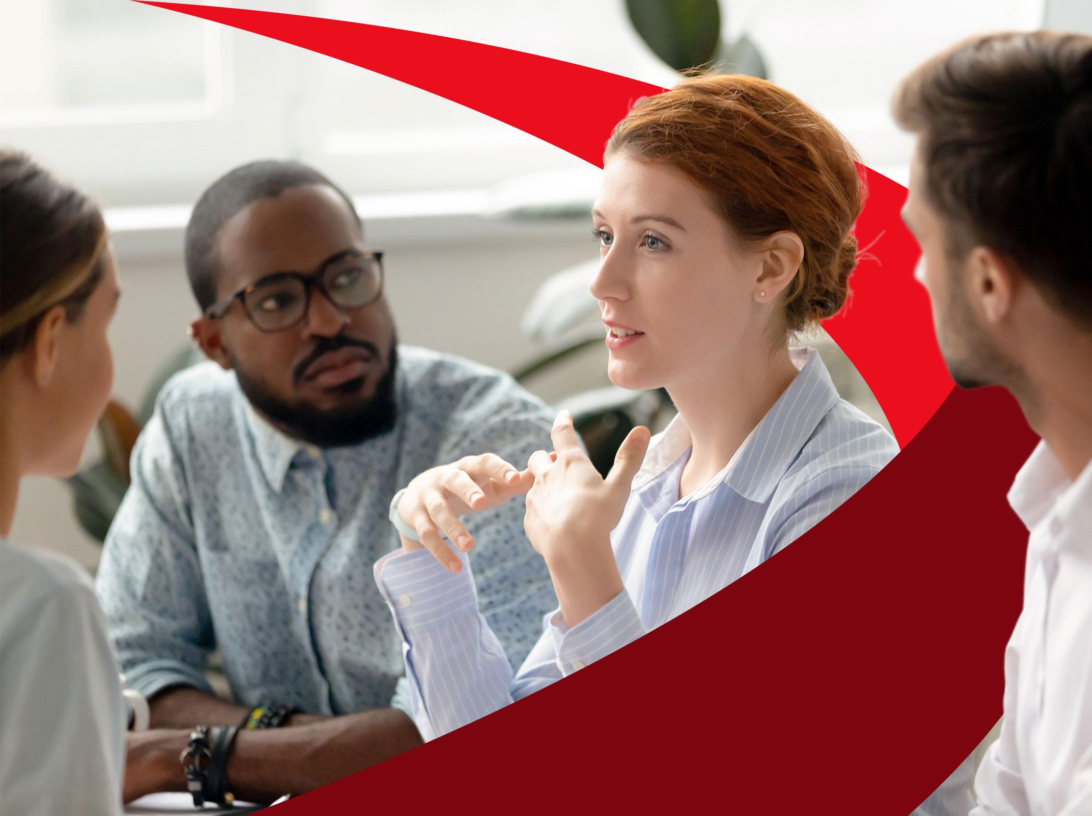 Business professional communicating to a group with assertiveness