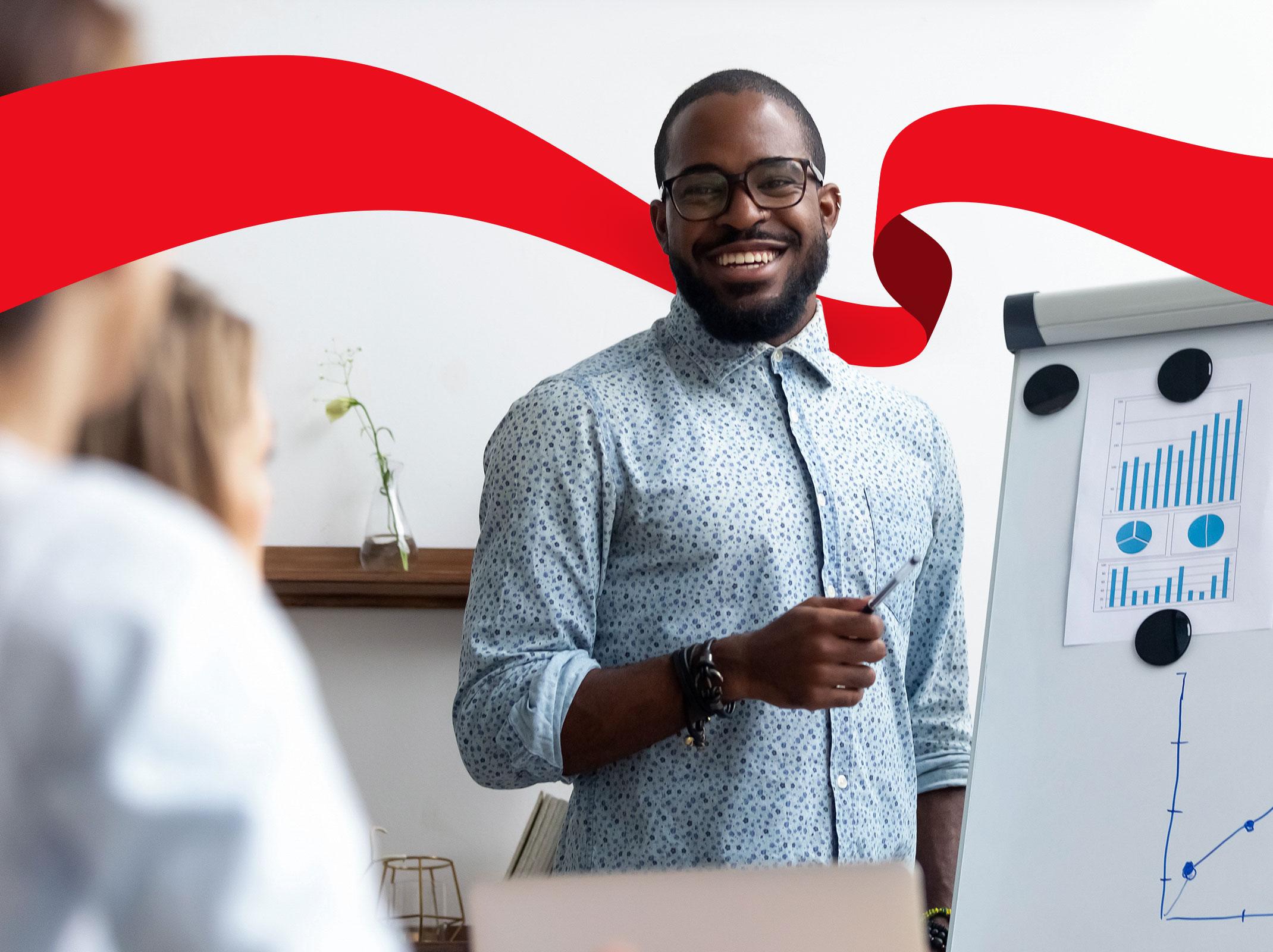 Business professional presenting in front of a white board.
