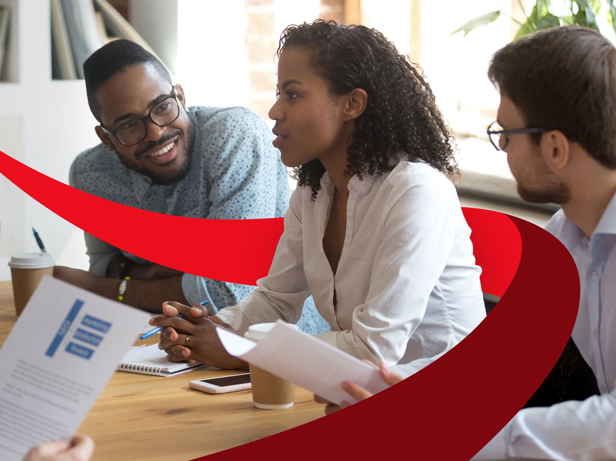 Supervisor talking to a team around a conference table